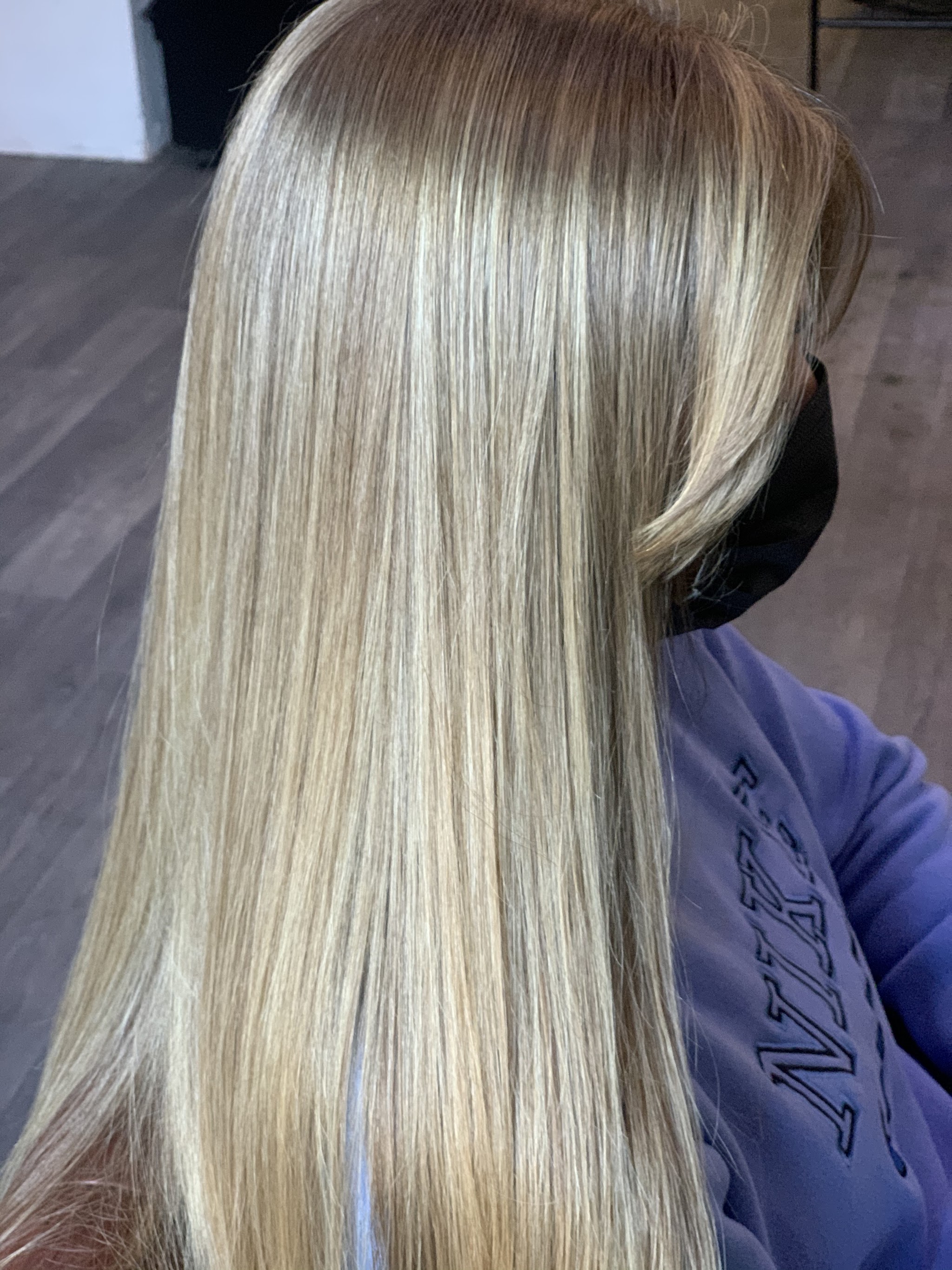 Long, sleek, straight blonde hair with fine highlights