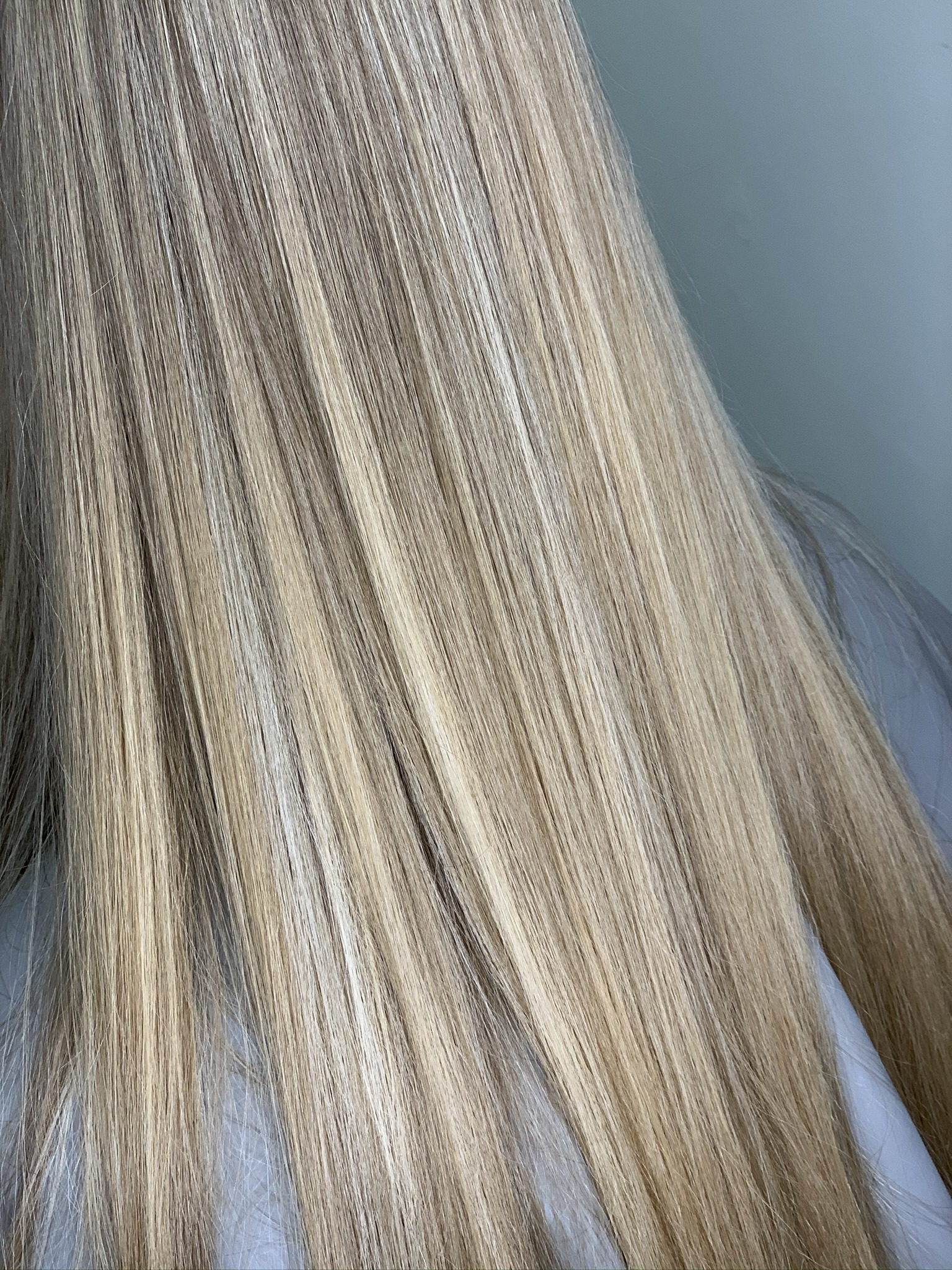 Long straight ash blonde hair with blended highlights